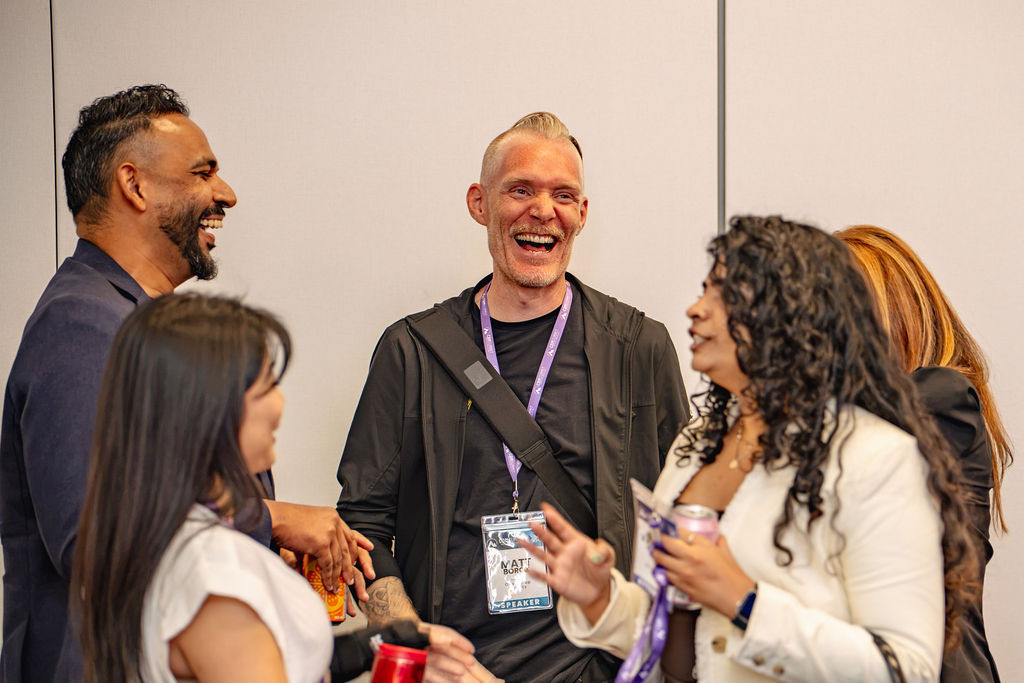 CDM Summit attendees laughing and talking together